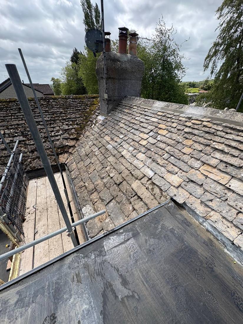 Cotswold stone roof with chimney stack