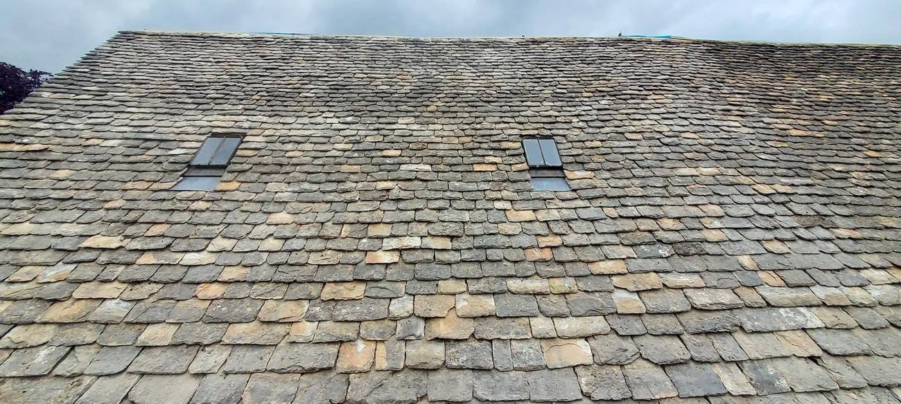Cotswold stone slate roof with rooflights
