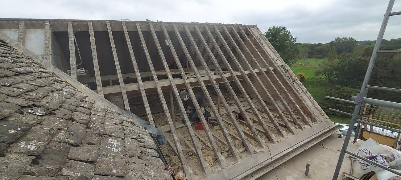 Original roof framing during re-roof process
